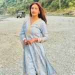 Surbhi Chandna Instagram - There is soo much beauty in Uttarakhand that its unreal Husband & I went on a getaway to Jim Corbett right after our wedding , the sweetest folks of @paatlidun.safari.lodge hosted us at their luxurious property and the experience has been surreal Seen here relishing our High Tea at the Kosi River and were fortunate enough to spot a Sambar Deer & few endangered Birds while we sipped on coffee made by @karanrsharma09 🤎 What an experience Enjoyed the property’s organic produce in the form of Kumaoni thali Also i have been super excited through this trip cause karan loves Safari and i haven’t experienced it ever The weather was Bomb wish we could stay longer 😍 Visiting you’ll super soon Wearing @shopmulmul
