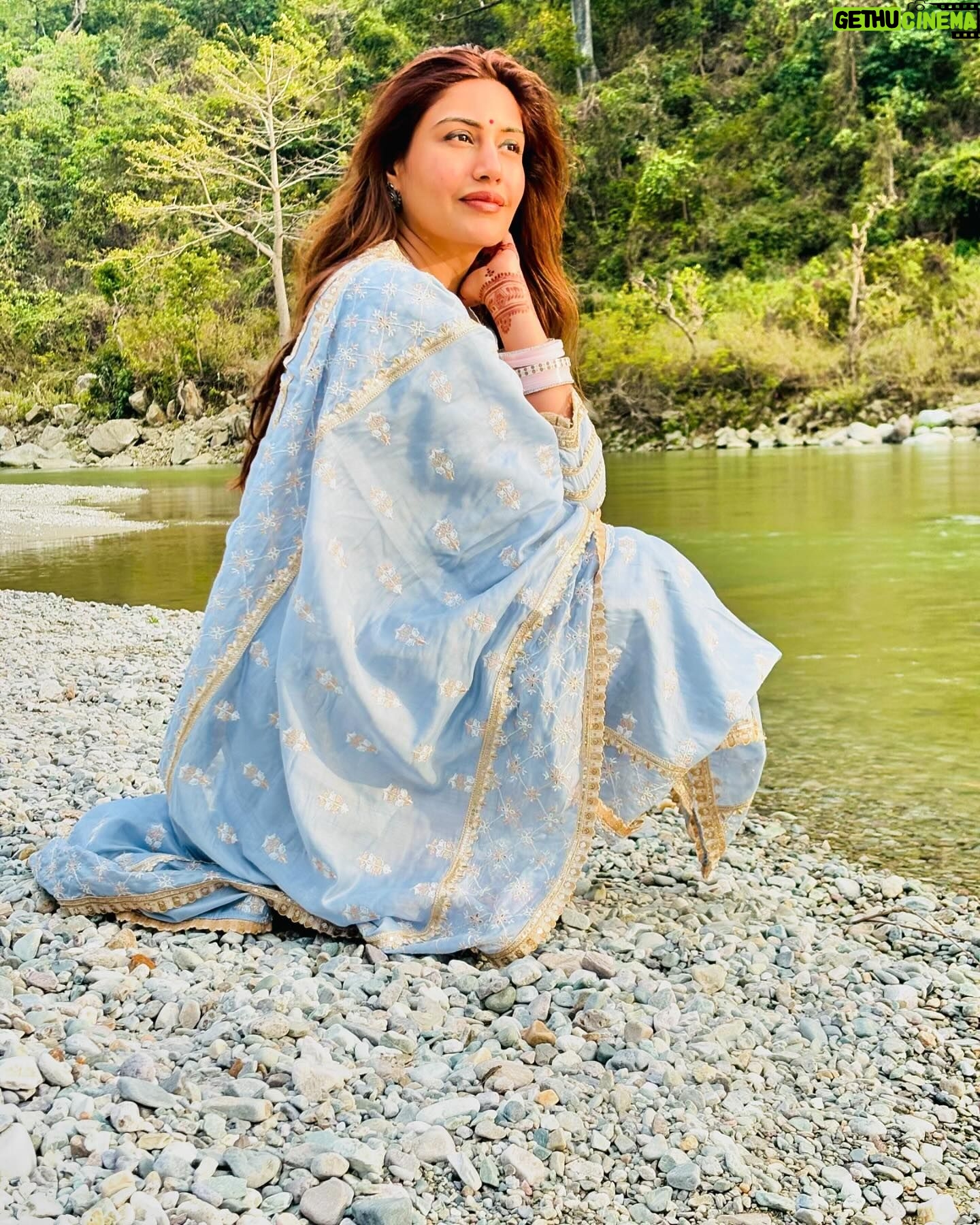 Surbhi Chandna Instagram - There is soo much beauty in Uttarakhand that its unreal Husband & I went on a getaway to Jim Corbett right after our wedding , the sweetest folks of @paatlidun.safari.lodge hosted us at their luxurious property and the experience has been surreal Seen here relishing our High Tea at the Kosi River and were fortunate enough to spot a Sambar Deer & few endangered Birds while we sipped on coffee made by @karanrsharma09 đ¤ What an experience Enjoyed the propertyâs organic produce in the form of Kumaoni thali Also i have been super excited through this trip cause karan loves Safari and i havenât experienced it ever The weather was Bomb wish we could stay longer đ Visiting youâll super soon Wearing @shopmulmul