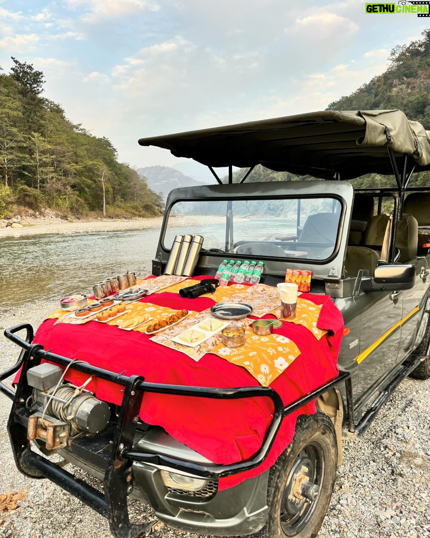 Surbhi Chandna Instagram - There is soo much beauty in Uttarakhand that its unreal Husband & I went on a getaway to Jim Corbett right after our wedding , the sweetest folks of @paatlidun.safari.lodge hosted us at their luxurious property and the experience has been surreal Seen here relishing our High Tea at the Kosi River and were fortunate enough to spot a Sambar Deer & few endangered Birds while we sipped on coffee made by @karanrsharma09 đ¤ What an experience Enjoyed the propertyâs organic produce in the form of Kumaoni thali Also i have been super excited through this trip cause karan loves Safari and i havenât experienced it ever The weather was Bomb wish we could stay longer đ Visiting youâll super soon Wearing @shopmulmul