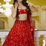 Swastima Khadka Instagram – ‘शालीन – Graceful’ – a collection that transcends the new  journey. Our artisans pour hours of hard work, love, and attention to detail into perfection. At OODNI, we’re delighted to present these impeccable designs, adding an exceptional touch to this wedding season. 💖✨ 

A sleeveless cut-work blouse complements this red crystal bead embroidered lengha, topped off with a shawl meticulously crafted with thread and crystal embroidery. Handcrafted by our artisans, this ensemble is a labor of love for our bridal collection, “शालीन.”

On frame – @swastimakhadka 
Jewels – @shreeom_jewellers | @sbd_nepal 
Hair and Makeup – @shradha_maskey | @ritu.chhantyal 
Location- @rambaghmahal 
Lenses- @bibek_shrestha10 | @ilonfilms 
#oodni #oodnikhushbudangol #bridal #wedding #weddingseason #GracefulCollection