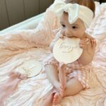 Tara Lipinski Instagram - Welp I better post her 7 month pictures considering next week she is 8 months!!! Moms- how do you take these pics when they are moving all around lol?! This is getting challenging. #7monthsold #babygirl #parenting #momanddad #babypics #babymilestones #babyonthemove