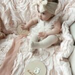 Tara Lipinski Instagram – My squirmy little munchkin. Taking these month milestone pics are proving to be more difficult every month. She is all over the place! It’s her little (big) cheeks for me. I could just eat her 🍰

#babypics #5monthsold #babygirl #babylove❤️ #girlmom #newbornbaby #babycheeks