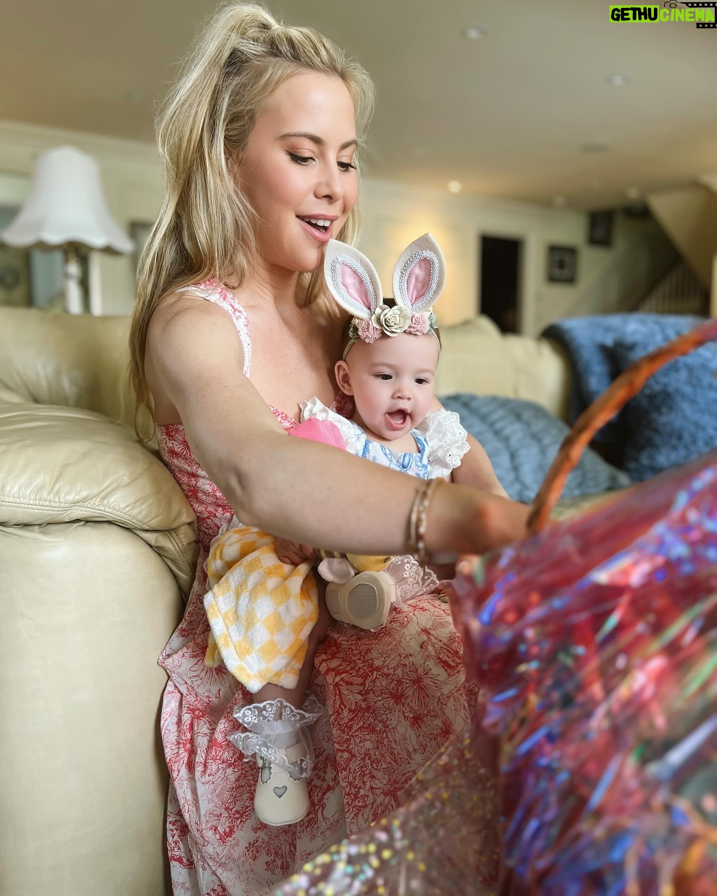 Tara Lipinski Instagram - Georgie’s first Easter and too many pics to count. Some of the ones that didn’t make stories. 🐰🥕 Our little family. 🫶 Hoping Sully thought the Easter basket was for him. Little man is so good with her, he just wants *needs* to part of everything. #easter #babysfirsteaster #babygirl #baby #6monthsold #parenting #babyanddog