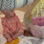 Tara Lipinski Instagram - Georgie’s first Easter and too many pics to count. Some of the ones that didn’t make stories. 🐰🥕 Our little family. 🫶 Hoping Sully thought the Easter basket was for him. Little man is so good with her, he just wants *needs* to part of everything. #easter #babysfirsteaster #babygirl #baby #6monthsold #parenting #babyanddog