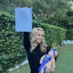 Tara Lipinski Instagram - Georgie’s 1st Halloween! ⛸️❄️ @bradgriffies made a costume that will be hard to match. Thank you!!!! Does anyone recognize it?! @toddkap commentated Gigi’s performance and I of course gave her an old school perfect 6.0 score of course! Brad - again thank you! It’s just too much. You are a talent and skaters are lucky to wear your beautiful designs. #babysfirsthalloween #halloween #newbornhalloween #figureskating #skating #olympics