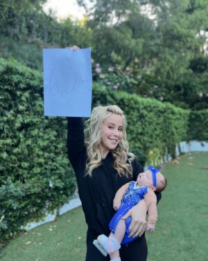 Tara Lipinski Instagram - Georgie’s 1st Halloween! ⛸️❄️

@bradgriffies made a costume that will be hard to match. Thank you!!!! Does anyone recognize it?! 

 @toddkap commentated Gigi’s performance and I of course gave her an old school perfect 6.0 score of course! 

Brad - again thank you! It’s just too much. You are a talent and skaters are lucky to wear your beautiful designs. 

#babysfirsthalloween #halloween #newbornhalloween #figureskating #skating #olympics