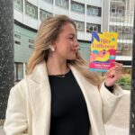 Tasha Ghouri Instagram - I’m so excited to finally show you all the cover of my first book, Hits Different! Thank you to @nicandlou and @beth_free_designs for creating such a stunning, summery, inclusive cover 🤍 Only 4 months left until Hits Different is out in the world. Representation was key for this book. I can’t wait for all of you to meet Cassie and join her on a summer of love, dance and adventure. It’s a journey about self love with her cochlear implant and finding her way to embracing her deafness! Also her non binary bestie who helps her along the way. Thank you @littlehux for bringing this book to life, you are an incredible talented writer! It’s been amazing to collab with you on this 🥹 Hits Different is out on June 6th with @hotkeybooks, and you can pre-order your copy now 💕🫶🏼🤍 AD