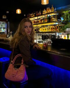 Teagan Croft Instagram - Turning nineteen means your drink MUST match your bag 🎀 @prada #pradamoonbag