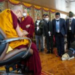 Tenzin Gyatso Instagram – A sniffer dog salutes His Holiness the Dalai Lama, joined by vigilant security personnel, embodying a shared commitment to respect and safeguarding. #dalailama #security #snifferdog