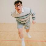 Thomas Sanders Instagram - getting kicked out of the country club 🎾 (📸: @jameslightner; 👕: @dpstyledme) it’s officially been TEN YEARS since Patton first made the scene as Dad Guy in my Vines. Ten years I’ve been with this character. I love him so much. So we created a fun look inspired by him. And I have him playing tennis… cause he would make a TEN-nis joke. Happy “Birthday”, Patton 🩵🎂