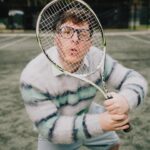 Thomas Sanders Instagram - getting kicked out of the country club 🎾 (📸: @jameslightner; 👕: @dpstyledme) it’s officially been TEN YEARS since Patton first made the scene as Dad Guy in my Vines. Ten years I’ve been with this character. I love him so much. So we created a fun look inspired by him. And I have him playing tennis… cause he would make a TEN-nis joke. Happy “Birthday”, Patton 🩵🎂