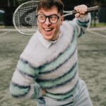 Thomas Sanders Instagram - getting kicked out of the country club 🎾 (📸: @jameslightner; 👕: @dpstyledme) it’s officially been TEN YEARS since Patton first made the scene as Dad Guy in my Vines. Ten years I’ve been with this character. I love him so much. So we created a fun look inspired by him. And I have him playing tennis… cause he would make a TEN-nis joke. Happy “Birthday”, Patton 🩵🎂