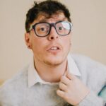 Thomas Sanders Instagram - getting kicked out of the country club 🎾 (📸: @jameslightner; 👕: @dpstyledme) it’s officially been TEN YEARS since Patton first made the scene as Dad Guy in my Vines. Ten years I’ve been with this character. I love him so much. So we created a fun look inspired by him. And I have him playing tennis… cause he would make a TEN-nis joke. Happy “Birthday”, Patton 🩵🎂