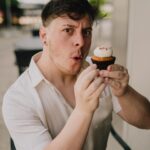 Thomas Sanders Instagram - Presenting… the BEST way to eat a cupcake… 🧁 To think where I was at emotionally on my last birthday compared to where I am now… I have so much to be thankful for. I’m grateful to my friends for their support and comfort. I’m grateful to my career, which has graciously allowed me to turn what brings me joy into something that can sustain myself. And I’m also grateful for finding so much of my self-worth this year, bringing me up from my lowest point last March. I made it through that storm to where I am now, and I couldn’t feel more lucky. To all of you who encourage me in any small way… I sincerely thank you from the bottom of my heart. Looking forward to what this next year will bring. 💜🎂 (Photography: @jameslightner)