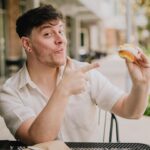 Thomas Sanders Instagram - Presenting… the BEST way to eat a cupcake… 🧁 To think where I was at emotionally on my last birthday compared to where I am now… I have so much to be thankful for. I’m grateful to my friends for their support and comfort. I’m grateful to my career, which has graciously allowed me to turn what brings me joy into something that can sustain myself. And I’m also grateful for finding so much of my self-worth this year, bringing me up from my lowest point last March. I made it through that storm to where I am now, and I couldn’t feel more lucky. To all of you who encourage me in any small way… I sincerely thank you from the bottom of my heart. Looking forward to what this next year will bring. 💜🎂 (Photography: @jameslightner)