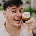 Thomas Sanders Instagram - Presenting… the BEST way to eat a cupcake… 🧁 To think where I was at emotionally on my last birthday compared to where I am now… I have so much to be thankful for. I’m grateful to my friends for their support and comfort. I’m grateful to my career, which has graciously allowed me to turn what brings me joy into something that can sustain myself. And I’m also grateful for finding so much of my self-worth this year, bringing me up from my lowest point last March. I made it through that storm to where I am now, and I couldn’t feel more lucky. To all of you who encourage me in any small way… I sincerely thank you from the bottom of my heart. Looking forward to what this next year will bring. 💜🎂 (Photography: @jameslightner)