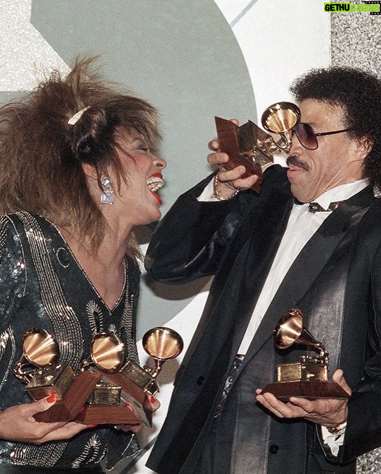 Tina Turner Instagram - Tina Turner and Lionel Richie celebrating their Grammy wins on February, 26 in 1985 in Los Angeles. Tina took home Record Of The Year along with two other awards, while Lionel scored Album Of The Year and Producer Of The Year (Non-Classical).