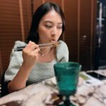 Tracy Chu Instagram – Posing for mom versus mom deciding the shot. 📸😋🍜 @voynich.hk