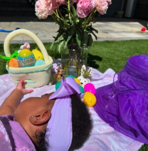 Uzo Aduba Instagram - What a great first Easter we had together as a family with baby girl. Weather said rain, but it’s been sunny blue skies all day. Couldn’t be happier:). Happy Easter everybody! He is Risen. 💜🐰🐣✝️ #easter