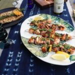 Valerie Bertinelli Instagram - 👩🏻‍🍳 Gah! I've been thinking about Salmon! 😅 So, it's time to switch up at the holiday table this year! 🎄 My "Salmon Kabob with Herb Sauce" is incredibly simple to prepare and tastes fantastic. ✨ The tasty herb sauce combines basil, parsley, garlic, and lemon zest; the marinade for the Salmon is a simple mixture of olive oil, Italian seasoning, salt, and pepper. YUM! 😋 What's more, these kebabs are delicious, whether grilled indoors or out, so you can enjoy them no matter the weather and make them your own by adding your favorite vegetables and herbs to the sauce. Try it out and add the warmth and joy of home cooking to your holiday festivities! 🥰 Recipe link in bio! 💕 Enjoy! Cooking Song: "Rockin' Around the Christmas Tree" by Brenda Lee