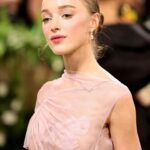 Victoria Beckham Instagram - British star, Phoebe Dynevor wore a custom Victoria Beckham gown to last night’s Met Gala. In a nod to this year’s ‘Sleeping Beauties’ theme, the ethereal silhouette was hand-crafted from archival lace, and embellished with over 300 lace appliqué flowers, hand-cut and hand-sewn onto a tulle base. Find out more in stories… #VBMetGala