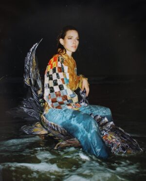 Victoria Pedretti Instagram - Sturgeon Rider
acrylic paint on inkjet print (35 mm Kodak)

photographer/shoot director: @gcrmccarthy 
painting: @aoksner 
clothing designer: @selina_sanders 
model: @then0t0ri0usvip 
mua/hair: @naturallydeij 

Currently on view as part of “Our Hour” group show @helmelstudios. Visible by appointment or during public walkthroughs:
Monday 12/12/22 7-9pm
Saturday 12/1722 7-9pm