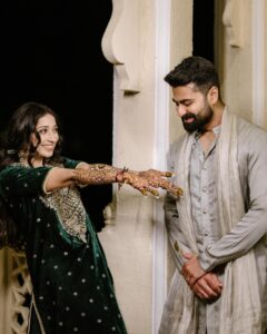 Vrushika Mehta Instagram - Mehendi night was filled with colours and giggles. We had a fun mission too – getting Saurabh to find his name in the mehendi design! 😄💍 Our families danced, laughed, and celebrated together, making it a beautiful night filled with love and joy. 💃❤️ Captured by: @smaryafilms Wearing: @gulabo_jaipur Jewellery: @neo_jewellers #rabhdivrushyy #mehndi