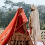 Vrushika Mehta Instagram - Picking the red lehenga wasn't just a choice; it was like making a dream come true. Everything worked out exactly how I wanted! Thank you @asopalav ❤️ And how can I forget the traditional yet elegant veil made by my mom and @_usha_maurya aunty ❤️ Captured by: @smaryafilms Jewellery: @paldzigns.jewel #rabhdivrushyy #wedding