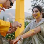 Vrushika Mehta Instagram - Under the Tuscan sun of love, surrounded by the warmth of family and friends, we painted our journey in shades of joy at our Italian-themed Haldi ceremony. 💛✨ Blessed with love, laughter, and countless memories. ❤ . Captured by: @smaryafilms Jewellery: @houseofdoro Designed & Managed by: @faith13_events #rabhdivrushyy #haldi