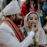 Vrushika Mehta Instagram - With the warmth of family, the laughter of friends, and blessings all around, we found our home in one another's hearts. Saying 'yes' became a promise for a lifetime. 🧿♾️ . Captured by: @smaryafilms Wearing: @asopalav Jewellery: @paldzigns.jewel Design & Management: @faith13_events Kaleera: @beabhika #rabhdivrushyy #wedding