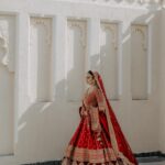 Vrushika Mehta Instagram - Picking the red lehenga wasn't just a choice; it was like making a dream come true. Everything worked out exactly how I wanted! Thank you @asopalav ❤️ And how can I forget the traditional yet elegant veil made by my mom and @_usha_maurya aunty ❤️ Captured by: @smaryafilms Jewellery: @paldzigns.jewel #rabhdivrushyy #wedding
