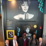 Whitney Houston Instagram - At the newly redesigned service area on the Garden State Parkway in New Jersey, guests are now greeted by a captivating and towering image of Whitney Houston, accompanied by a biography and a display of the diamond record she earned for her timeless song, “I Will Always Love You.” The exhibit invites visitors to delve deeper into Whitney's iconic career, showcasing not only her achievements but also quotes and compelling images on an interactive “Selfie Monitor,” where visitors can pose for a photo alongside Whitney Houston or explore profiles of numerous other celebrated New Jersey Hall of Fame inductees. 📸: Photos Courtesy of New Jersey Hall of Fame (L to R)Steve Edwards, President, New Jersey Hall of Fame, New Jersey State Senator Joseph P. Cryan, Gary Houston, Pat Houston and State Senator Patrick J. Diegnan