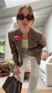 Whitney Port Instagram - Get dressed with me as I spill some of my vintage bag secrets and where I’ve been finding some of my favorites these days. VINTAGE: @rosebowl_fleamarket @thevintagemarche @shopnou_ @themillennialdecorator Wearing: @luvlou._ glasses @stagnistudio tank @rodarte pink 🌹 @almina_concept blazer @michaelcanale_official pants @chanelofficial flats @fleurdumalnyc bra