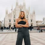 Yvonne Orji Instagram - Just a girl in the city of Milan, or as Barbara would say, “A Town’s woman.” (IYKYK 😉) • 📸: @modehunter Hair: @mitchellcantrellbeauty Makeup: @dalila_mua Coat: @thefrankieshop Top: @simkhai Pants: @khaite_ny Frames, shoes, jewelry: @ysl #milanfashionweek #mfw
