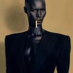 Yvonne Orji Instagram - I went Grace Jones for Tokyo James. • OF COURSE I attended the Nigerian designer showing at Milan Fashion Week! Duh! And Omo Naija DID. NOT. DISAPPOINT! @tokyojamess your designs were beyyonndd! Sooo many pieces I’m coming for! Thank you for having me and reppin 🇳🇬🇳🇬🇳🇬 so lovely!! • Hair: @mitchellcantrellbeauty Makeup: @madeleinefeeney Suit: @tokyojamess Styling: @georgmedley Shoes: @driesvannoten Frames: @ysl Earrings: @zara Swag: on a hundred thousand trillion. Knee game: skrroong (but that lean almost took me clean out 😂) 📸: @modehunter #milanfashionweek #mfw