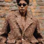 Yvonne Orji Instagram - I went Grace Jones for Tokyo James. • OF COURSE I attended the Nigerian designer showing at Milan Fashion Week! Duh! And Omo Naija DID. NOT. DISAPPOINT! @tokyojamess your designs were beyyonndd! Sooo many pieces I’m coming for! Thank you for having me and reppin 🇳🇬🇳🇬🇳🇬 so lovely!! • Hair: @mitchellcantrellbeauty Makeup: @madeleinefeeney Suit: @tokyojamess Styling: @georgmedley Shoes: @driesvannoten Frames: @ysl Earrings: @zara Swag: on a hundred thousand trillion. Knee game: skrroong (but that lean almost took me clean out 😂) 📸: @modehunter #milanfashionweek #mfw