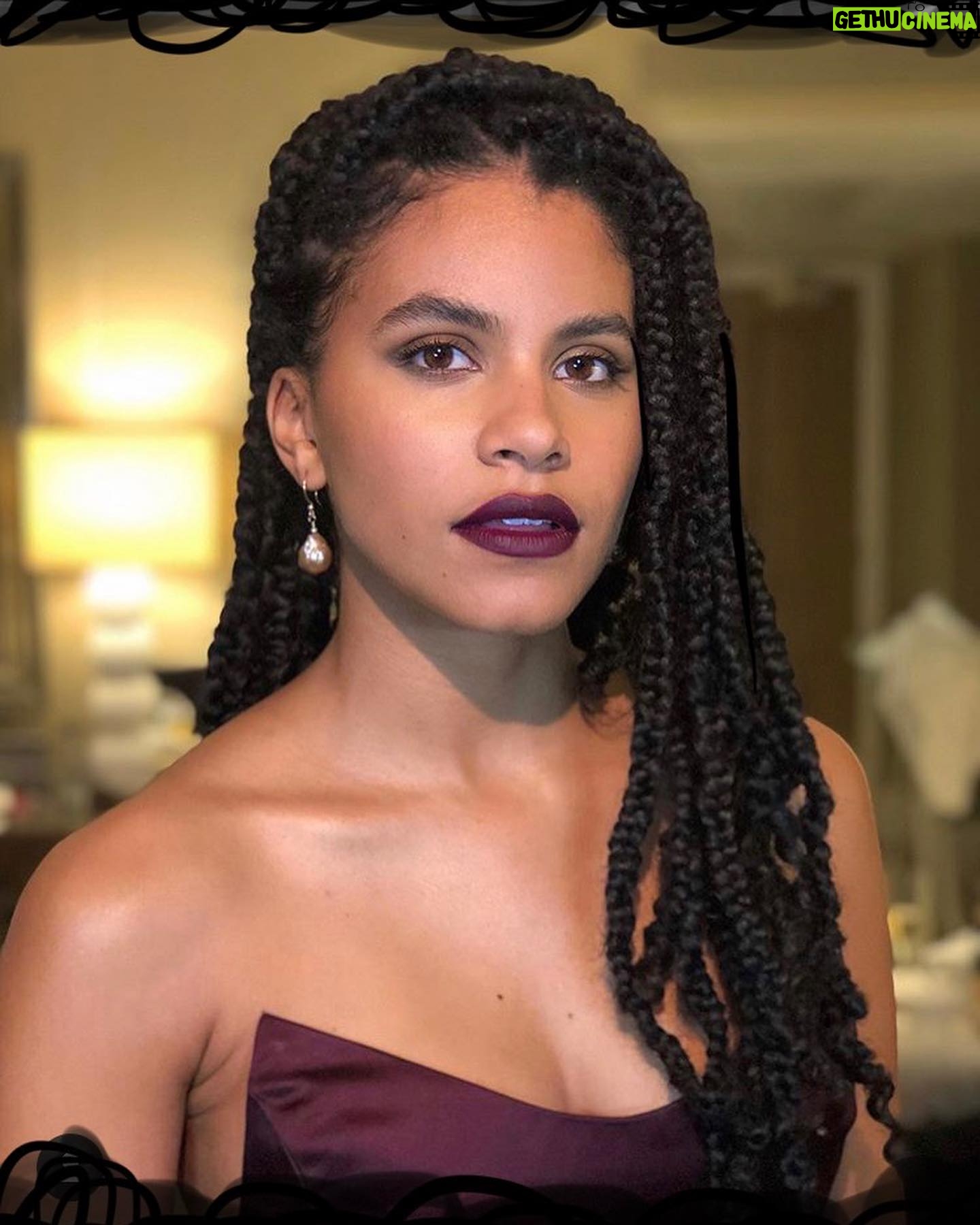 Zazie Beetz - 102.1K Likes - We did le BAFTAS!! Thank you to London for being so absolutely smashing, thank you Kensington Palace for being so ~royal~, thank you @PriyaSatiani for being that b*d b*tch 24/7 and being my manager/friend/sister, thank you @davidrysdahl for being that boo and being my guide and convincing me to party despite my utmost resistance- ultimately had a bloody great time.
Thank you to my WONDERFUL team, @Lacyredway on hair since day one, @babskymakeup for the vamp lip and calm energy, @solangefranklin for the threads and the lewk, @marinamoscone for the CUSTOM blood burgundy wine red gown.
Of course, thank you @jokermovie and @wbpictures for having me tag along and accompany this wonderful film. Thanks eggs for being delicious every morning, and thanks mango for being ripe in the U.K. Ya heard????? 🍳 Thanks British people for having accents, it means more to me than you know.
Anyhow, in New York now, but on my way to the airport to pop up in LA for another fantabulous awards weekend! Cheerio! 🇬🇧