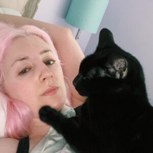 ALB in Wonderland Instagram - We lost our Dawn. She was my best friend. I’m grateful I got to hold her while we said goodbye, I promised her I would be there till the end and I got to keep my promise.
I want to tell you about the first time I knew Dawn and I belonged together.
Immigrating to a new country is a difficult and expensive process. When we finally got our approval in 2016 we moved Dawn & May here to Canada first, in November, and Niko was due to follow two months later, in January. We could not afford to spend Christmas together, and since I had the girls I couldn’t travel to go visit family. It was my first Christmas all alone. I think when you spend a major holiday alone you have to make a decision- try to make merry all by yourself, or pretend it’s not happening at all. I went with the latter. 
I ate a regular meal and watched tv. If I could convince myself it was just a regular day I could get through it.
But when midnight came and brought us to the 25th, I found myself sobbing, the kind of cry that makes you think you’re going to explode. Dawn got up and climbed onto my chest, one paw on each of my shoulder blades, staring me right in the face.
“I’m sorry, I’m sorry” I said to her. I couldn’t make myself calm down. I had never had a pet before and didn’t want to scare her. But she didn’t move. She stayed with her eyes locked on mine for as long as it took for me to start breathing normally again. Then she settled on my chest and we fell asleep. 
That was almost 6 years ago. And she slept on my chest every single night since.
Dawn was the kind of cat who ran to the door to greet us when we got home. She befriended everyone- the favourite of every maintenance man. If I called her name, she would come running. And if she called for me, I’d get up and come see her no matter what I was doing. My friends would laugh when I would do this but Dawn and I had a mutual understanding- if I need you, please find me.

It’s devastating, and in a weird way it makes complete sense that they would both pass so close to each other. They were adopted together as kittens and had never been apart their entire lives. Where one went, the other would follow. 

I need you, I need you. Please find me.