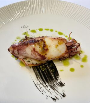 Aiste Miseviciute Instagram - Just a kilometer or so away from Bilbao Airport lies Spain's best-kept secret, Asador Taskas @asador_taskas. Although this seafood temple may have a surprising location, its stellar ingredients and impeccable grilling techniques merit a special trip not only from the airport arrivals. Whether it's superb Galician clams, giant langoustines, or the king of all fish, Cantabrian El Rey, Taskas owner Ángel Leon sources only the best ingredients from the Spanish seas. Here, time stands still, and you are transported to the ultimate seafood and ingredient temple, without any doubts, among the best in the Basque Country.

In the pictures

- Squid filled with caramelized onions
- Anchovies
- Home marinated salmon with orange sauce and black salt
- Green peppers 
- Grilled cigala
- Magnificent El Rey fish