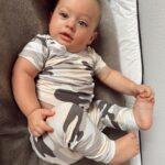 Alexandria DeBerry Instagram - BEAUX DIESEL months 6 7 ⚡️ (swipe for the cutest lil sushi roll in his new fit 🎎) officially 7 months today & has: 🇯🇵 moved to a new country got his 1st passport stamp ✈️ taken his 1st flight / taxi ride / train 🍓 started food & is a big fan of strawberries sweet potato ⚾️ attended his 1st baseball game (go @yomiuri.giants ) 🦷 had 2 bottom teeth poke through 💪🏼 can hold a plank starting to crawl 👀 has lashes a girl can only dream of 😁 thinks his daddy is hysterical 📸 loves the attention he gets from sweet strangers when out about here #babymilestones #6monthsold #7monthsold #beauxdiesel #babybeede2022 #babyfever #blueeyedboy #babyboystyle