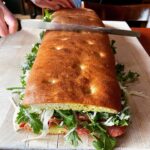Alice Waters Instagram – I love the sandwiches made on the Acme pizza bianca! There is always more filling than bread: the secret of a great sandwich. Bartavelle Cafe has shown us the way with salami, shaved fennel, aïoli and lots of rocket! And now we are making “to go” sandwiches for lunch at Panisse.