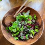 Alice Waters Instagram - My daughter @fannysinger picked ALL these beautiful lettuces from my front yard Victory Garden which has been such a source of so much happiness this past year ! The lettuces are so many different colors and texture and flavors, with the sweetest coriander flowers too. The bowl and salad spoons are from my collaboration with @permanentcollection.