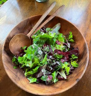 Alice Waters Instagram - My daughter @fannysinger picked ALL these beautiful lettuces from my front yard Victory Garden which has been such a source of so much happiness this past year ! The lettuces are so many different colors and texture and flavors, with the sweetest coriander flowers too. The bowl and salad spoons are from my collaboration with @permanentcollection.