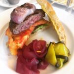 Alice Waters Instagram – Zuni does have the best hamburger in California because the meat is from an organic regenerative ranch , they cook it just right and spread the bread with aïoli! Tomatoes , pickles , mustard and grilled onions are the finishing touches. So happy to eat there today at lunch.