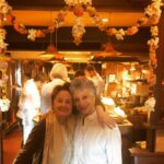 Alice Waters Instagram – Celebrating the lunar new year with Niloufer Ichaporia is my favorite meal at Panisse ! This photo was two years ago when the restaurant was decorated with garlands of marigolds, gardenias and chrysanthemums. This year, of course, we have our Niloufer inspired Parsi food “to go” and I am setting the table for five of us  at home with a garland Janet made. It is not the same  but beautiful and aromatic nonetheless….