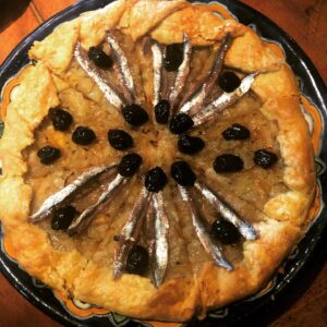 Alice Waters Instagram - Patty Curtan made the most delicious onion galette with anchovies and ripe black olives.
It is the best lunch with a big green lettuce salad with rocket and shaved fennel vinaigrette .One day I am going to learn how to make a galette pastry that is as flaky and tender as hers!