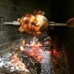 Alice Waters Instagram – The motor on my spit broke and we had to turn the turkey by hand for over two hours!  I am sure before the motors, it was the way it was done.  That accounts for the irregular browning. But it was a delicious heritage breed from Frank Reese in Kansas! Thank you Patrick Martins for introducing us.