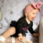 Alicia Banit Instagram – Cheeky munchkin is 11 months!

(And a day 😬)Oh my! As if she’s a month away from being ONE?! Every day keeps getting more and more fun, she brings so much joy to every single day! Especially when she’s having a laughing fit and snorts like a piggy! Girlfriend is on the move and crawling/trying to walk, she’s got her first molar with the other nearly through the gum and do I even need to say it? Has handled it like the champ she is! Her new favourite game is pretending to hand something to us to then steal it back, she thinks she’s hilarious! But also, she is. She’s poking her tongue out knowing she’s being cheeky, she loves talking and miss independent is so happy to play alone with her toys. Oh and can stand up in her cot! On the other hand she’s very clingy to mummy right now and loves cuddles. I think she’s actually a crocodile, she has that death roll at nappy change time down pat! She loooves dancing, she could hear music in the other room and will start to jig along to everyone’s delight and she definitely has the Wog gene, she uses her hands very expressively to emphasise the importance of what she’s saying 🤌🏼👈🏼. I can’t believe she’s one next month! The love I have for this little munchkin is indescribable, we are so lucky she’s ours 🤍