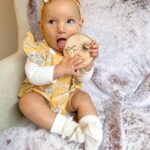 Alicia Banit Instagram - Happy half birthday Isla Joy! 6 MONTHS! I am actually mind blown that our baby girl is half a year old! Where has the time gone?! This has been a big month for Isla! Our lil pumpkin is eating pumpkin like it’s going out of fashion, she laughs so hard at the most random things (like Detho eating soup) and loves going for walks in her pram. So much so that she squeals with excitement and kicks her legs as if to say LETS GOOO! She babbles to herself a lot and then yells very loudly! Her favourite song is ‘You Make My Dreams (Come True) and she’s obsessed with Mud, morning chats with daddy and her grandparents. She has the sweetest little personality and is so social, she loves everyone! We can’t wait to see who she becomes over the next 6 months and beyond. We are so incredibly lucky to be her parents, our smiley girl is our whole world 🤍🖤