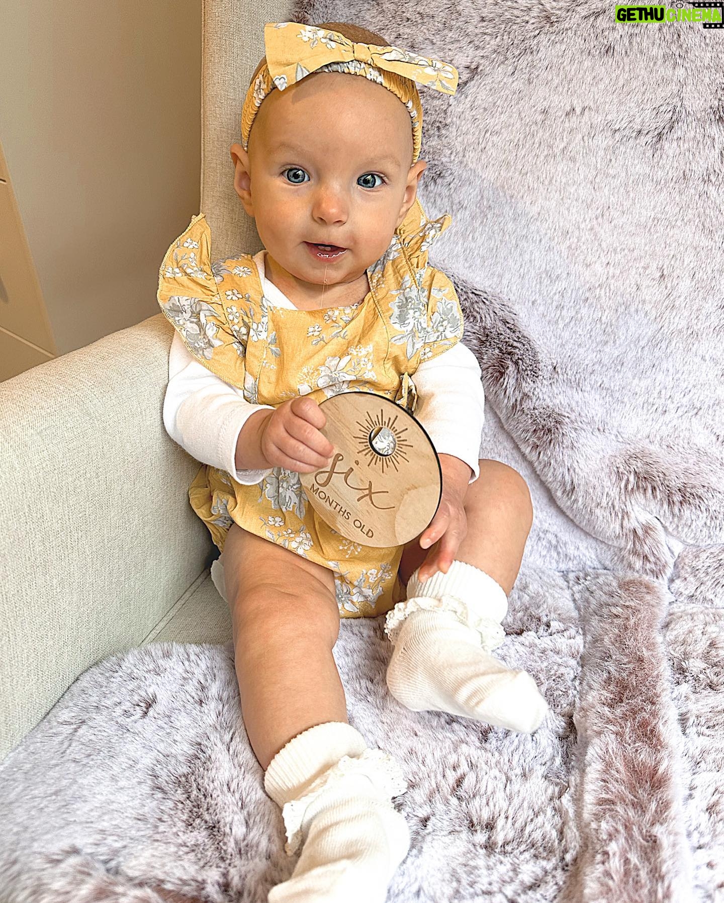 Alicia Banit Instagram - Happy half birthday Isla Joy! 6 MONTHS! I am actually mind blown that our baby girl is half a year old! Where has the time gone?! This has been a big month for Isla! Our lil pumpkin is eating pumpkin like it’s going out of fashion, she laughs so hard at the most random things (like Detho eating soup) and loves going for walks in her pram. So much so that she squeals with excitement and kicks her legs as if to say LETS GOOO! She babbles to herself a lot and then yells very loudly! Her favourite song is ‘You Make My Dreams (Come True) and she’s obsessed with Mud, morning chats with daddy and her grandparents. She has the sweetest little personality and is so social, she loves everyone! We can’t wait to see who she becomes over the next 6 months and beyond. We are so incredibly lucky to be her parents, our smiley girl is our whole world 🤍🖤